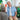 Older man sitting on a coach holding a can of Boost Oxygen Rapid Response.