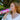 Woman using a can of Boost Oxygen Balance.