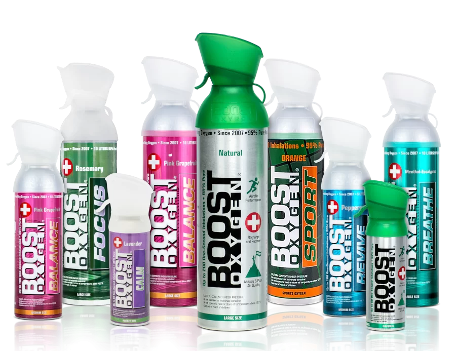 A group of Boost Oxygen spray bottles in various flavors and strengths.