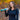 Young woman outside with trees in the background holding a can of Boost Oxygen Breathe.