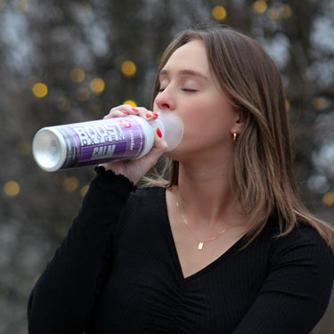 Young woman using Boost Oxygen Calm.