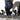 Person lifting weights with can of Boost Oxygen Stars and Stripes on the floor near them.