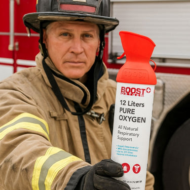 Firefighter holding a Boost Oxygen Rapid Response canister.