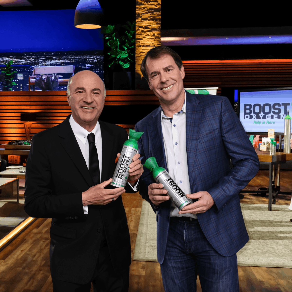 Boost Oxygen founder Rob Neuner with Kevin O'Leary holding cans of Boost Oxygen