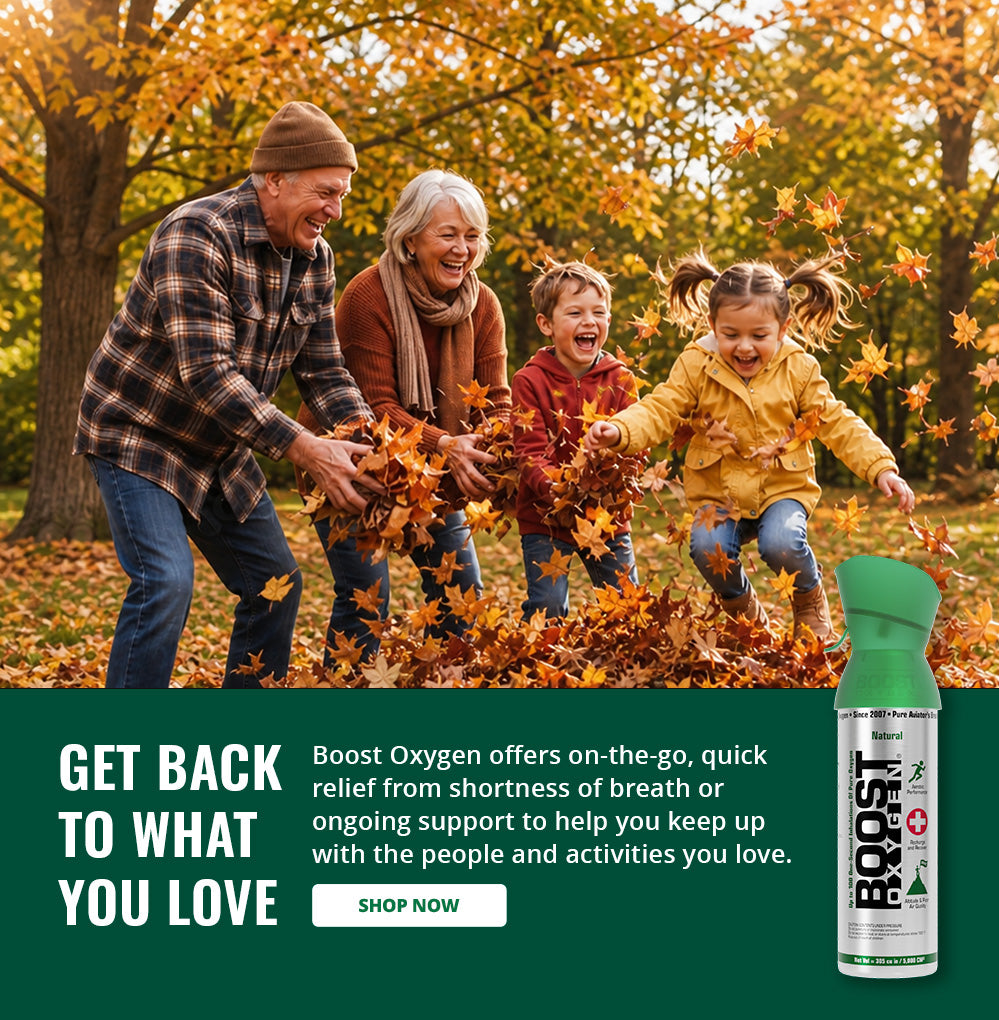 A family playing in fallen autumn leaves outdoors, with a Boost Oxygen Natural can shown in the lower right on a dark green promotional background with text saying 